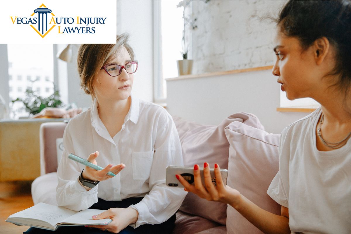 A behavioral health specialist speaks to a client about coping with trauma after their car accident.