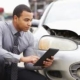Las Vegas car accident attorney appraises vehicle damage.