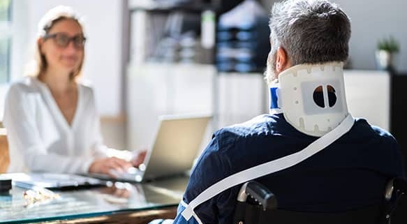 A victim of a bodily injury meets with a legal professional to discuss his options regarding liability.